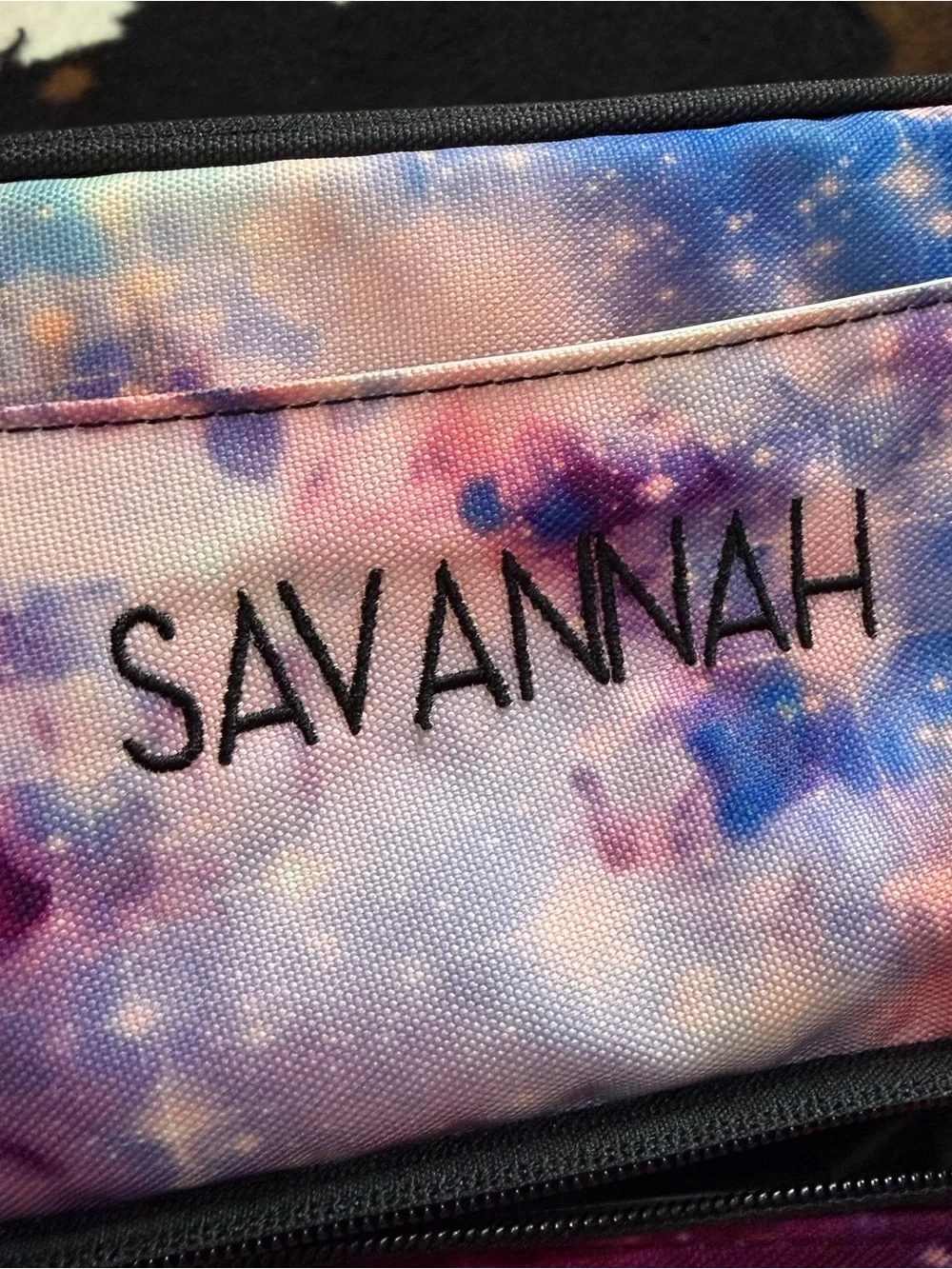 Colorful Pottery Barn Teen lunch bag featuring a vibrant galaxy print in shades
